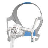 ResMed AirFit N20 nasal mask with gray headgear and clear nasal cushion, angled view.