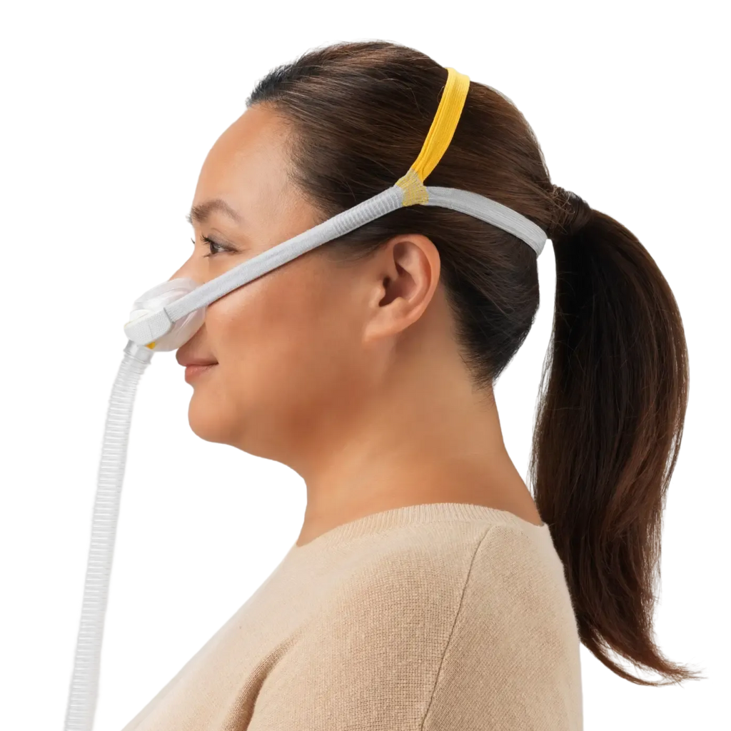 Side-view image of a woman wearing a Solo Mask, which includes the Solo Mask Headgear.