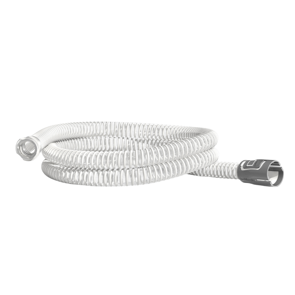 ResMed white corrugated CPAP tubing coiled on a black background